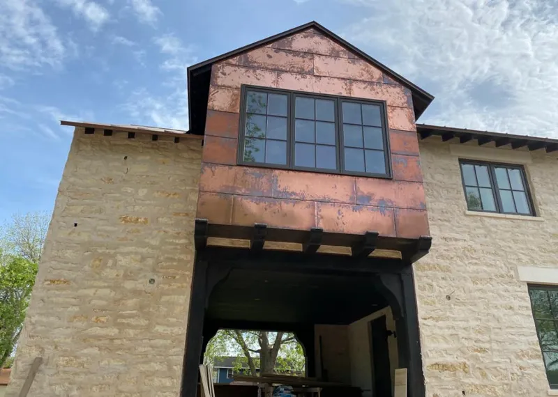 Copper metal panel facade on a stone building for Metal Roof Coating in White Center