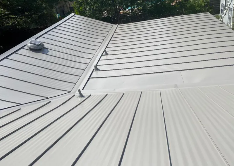Solar attic fan installed on a metal roof for Roof Ventilation in White Center